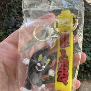 Tom cat with a key ring and a wrist band